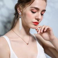 European And American Pearl Tassels Diamond Long Symmetrical Earrings main image 1