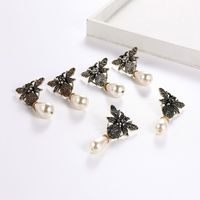 European And American New Alloy Diamond Insect Series Little Bee Ear Studs Exaggerated Pearl Pendant Temperament Female Earrings Hot Sale main image 1