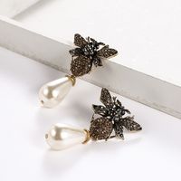 European And American New Alloy Diamond Insect Series Little Bee Ear Studs Exaggerated Pearl Pendant Temperament Female Earrings Hot Sale main image 4