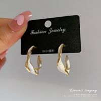 Korean New Retro Earrings Female Simple Personality Twisted Glaze Ring Earrings Wholesale main image 3