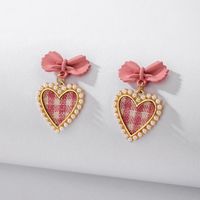 925 Silver Needle Vintage Pearl Fabric Love Heart Bow Tie Earrings European And American Ins Simple Autumn And Winter Check Graceful Earrings sku image 1