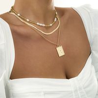 Simple Imitation Pearl Rice Bead Clavicle Snake Bone Chain Metal Letter Tag Necklace Set main image 1