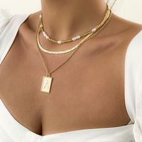 Simple Imitation Pearl Rice Bead Clavicle Snake Bone Chain Metal Letter Tag Necklace Set main image 3
