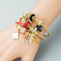 Europäische Und Amerikanische Neue Mode Diy Blume Brief Legierung Dora Armband Einfache Und Vielseitige Perlen Stahldraht Armband Zubehör main image 1