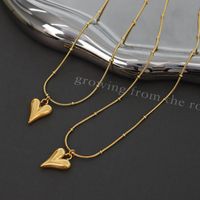 Collier En Acier Au Titane Avec Coeur De Pêche À La Mode En Gros main image 3