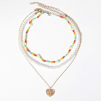 New Multi-layer Stacking Daisy Rice Beads Heart-shaped Embossed Pearl Necklace Wholesale main image 3