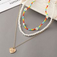 New Multi-layer Stacking Daisy Rice Beads Heart-shaped Embossed Pearl Necklace Wholesale main image 4