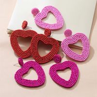 Holiday Color Ethnic Red Bead Hollow Heart-shaped Earrings main image 1