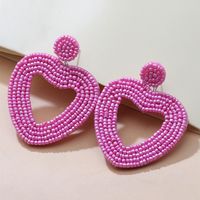 Holiday Color Ethnic Red Bead Hollow Heart-shaped Earrings sku image 1