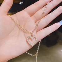 Chaîne De Clavicule En Forme De Coeur Incrustée De Perles De Mode Collier En Cuivre À Chaîne Courte En Gros main image 4