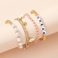 Ethnic Style Small Daisy Letter Pearl Beaded Bracelet Hand Jewelry Wholesale main image 1
