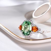 New Green Tourmaline Ring Shining Bright Orange Red Fanta Stone Inlaid Open Copper Ring main image 3