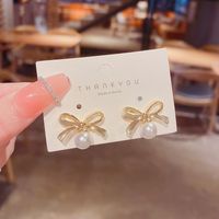 Korean New Simple Geometric Bow Pearl Copper Earrings Wholesale main image 1