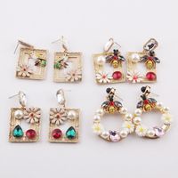 Fashion Bee Diamond-studded Pearl Metal Flower Earrings Wholesale main image 1