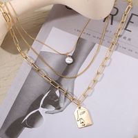 Fashion Alloy Multilayer Pearl Embossed Face Necklace Wholesale main image 3