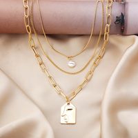 Fashion Alloy Multilayer Pearl Embossed Face Necklace Wholesale main image 5