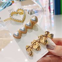 Korean Style Bow Metal Pearl Heart-shape Alloy Hairpin main image 1