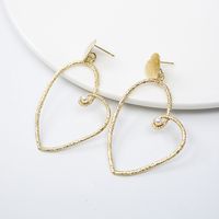 Gold Heart-shaped Cold Wind Pearl Love Earrings Wholesale main image 1