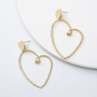 Gold Heart-shaped Cold Wind Pearl Love Earrings Wholesale main image 3