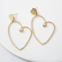 Gold Heart-shaped Cold Wind Pearl Love Earrings Wholesale main image 5