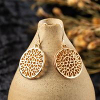 Fashion Round Hollow Carved Flower Alloy Earrings main image 1