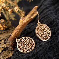 Fashion Round Hollow Carved Flower Alloy Earrings main image 3