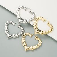 Retro Simple Metal Texture Hollow Heart Shaped Alloy Glossy Earrings main image 2