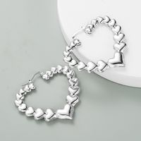 Retro Simple Metal Texture Hollow Heart Shaped Alloy Glossy Earrings main image 4