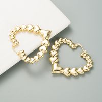 Retro Simple Metal Texture Hollow Heart Shaped Alloy Glossy Earrings main image 5