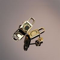 Fashion Copper Inlaid Color Zircon Lock Carved Earrings main image 3