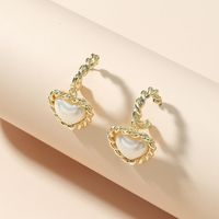 Fashion Twist Heart-shape Pearl Alloy Earrings Wholesale main image 3