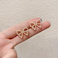 Simple Style Bow Knot Inlaid Pearls Alloy No Inlaid Earrings Ear Studs main image 3