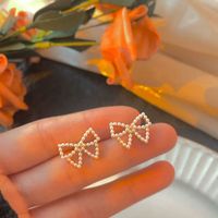 Simple Style Bow Knot Inlaid Pearls Alloy No Inlaid Earrings Ear Studs main image 4