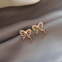 Korean Style Pearl Bow Earrings Wholesale main image 1