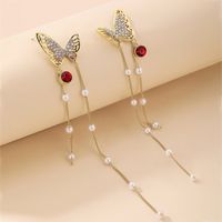 Nihaojewelry Jewelry Wholesale Retro Pearl Rhinestone Butterfly Tassel Earrings main image 1