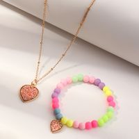 Nihaojewelry Großhandel Schmuck Koreanische Süßigkeit Farbe Perlen Herz Anhänger Kinder Armband Halskette Set main image 1