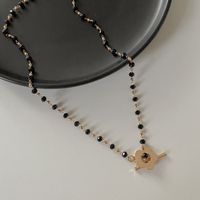 Wholesale Jewelry Black Crystal Glass Bead Chain Flower Pendant Ot Buckle Necklace Nihaojewelry main image 1