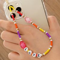 Vente En Gros Accessoires Lettre Perles De Riz Souriant Chaîne De Téléphone Portable Nihaojewelry sku image 1