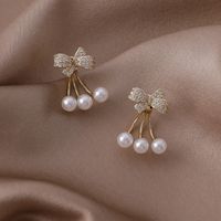 Vente En Gros Boucles D&#39;oreilles En Cuivre Perle Bowknot Zircon Micro-incrusté Nihaojewelry main image 1