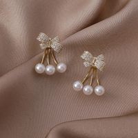 الجملة بسيطة مايكرو مطعمة الزركون Bowknot اللؤلؤ النحاس أقراط Nihaojewelry sku image 1