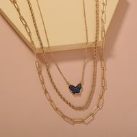 Großhandel Schmuck Lila Farbe Kristall Cluster Schmetterling Anhänger Mehrschichtige Halskette Nihaojewelry main image 1