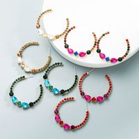 Großhandel Modelegierung Eingelegte Farbe Strass C-förmige Ohrringe Nihaojewelry main image 1