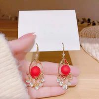 Nihaojewelry Fashion Red Pearl Diamond Spiral Earrings Wholesale Jewelry sku image 1