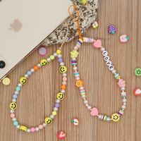 Nihaojewelry Wholesale Accessories Mixed Color Round Beads Yellow Smiley Face Mobile Phone Lanyard main image 1