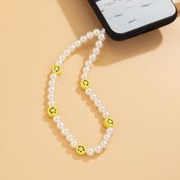 Wholesale Bohemian Style Soft Pottery Smiley Face Pearl Beaded Mobile Phone Chain Nihaojewelry main image 4