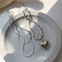 Einfaches Herz Spleißen Perle Schlangenknochen Gestapelte Kupferhalskette Großhandel Nihaojewelry main image 1