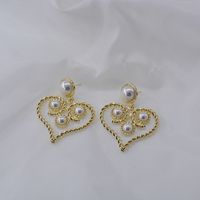 Baroque Retro Hollow Pearl Twist Heart Earrings Wholesale Nihaojewelry main image 5