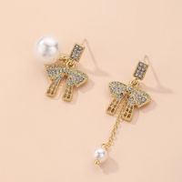 Fashion Asymmetrical Pearl Inlaid Rhinestone Bow Earrings Wholesale Nihaojewelry main image 1