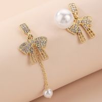 Fashion Asymmetrical Pearl Inlaid Rhinestone Bow Earrings Wholesale Nihaojewelry sku image 1