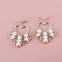 Fashion Pearl Geometric Hollow Heart Inlaid Rhinestone Metal Earrings Wholesale Nihaojewelry main image 3